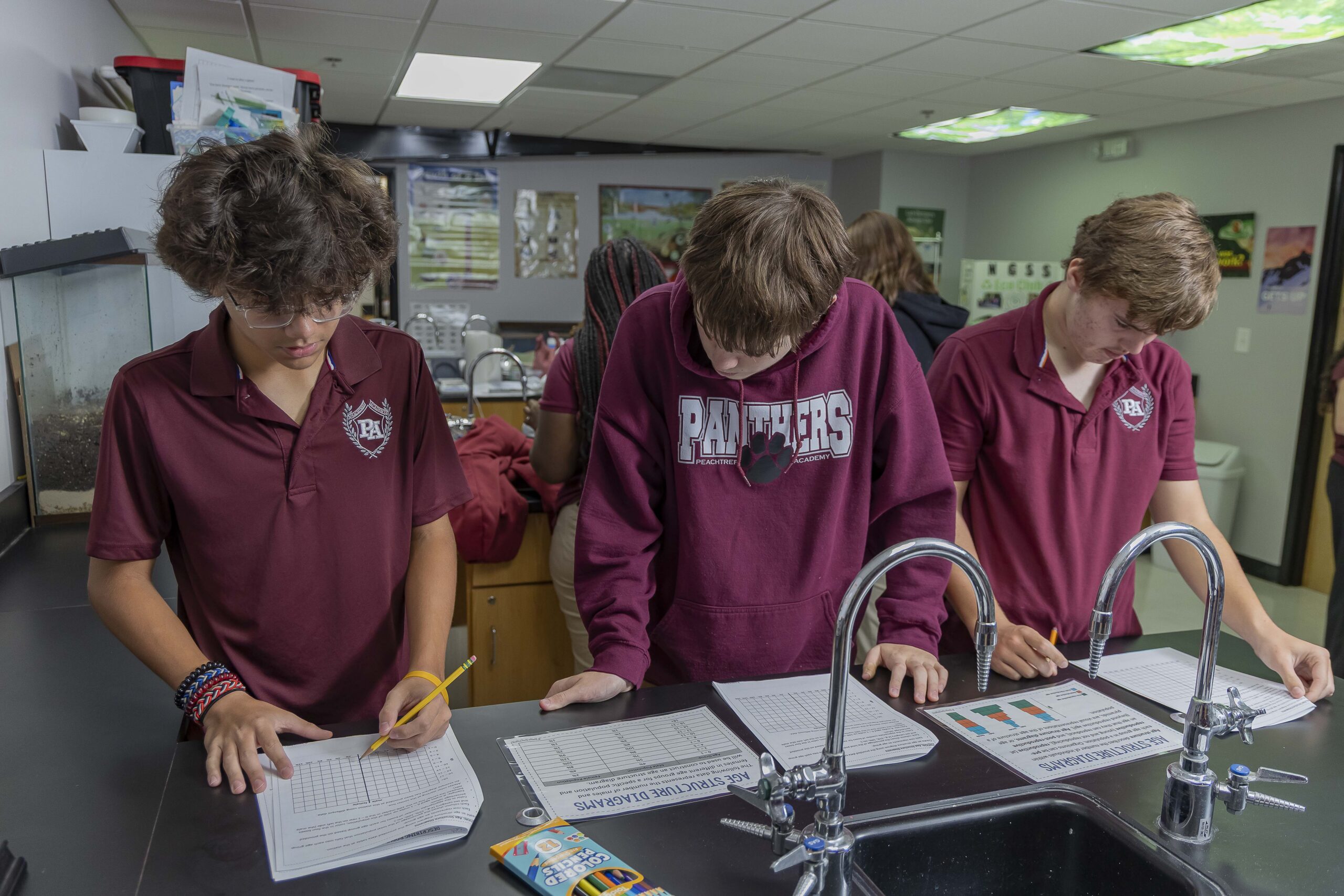 Peachtree Academy high school students participating in hands-on learning