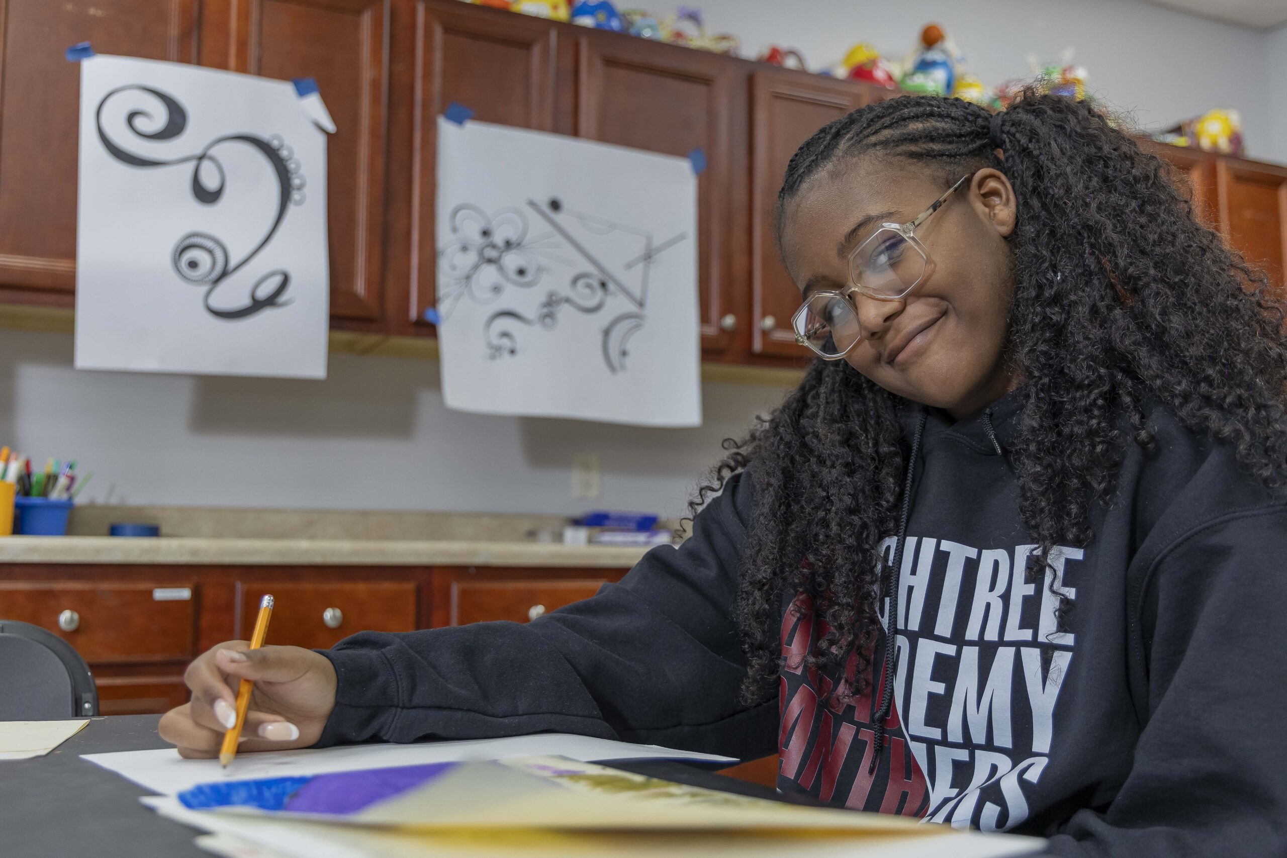 Peachtree Academy student creating artwork